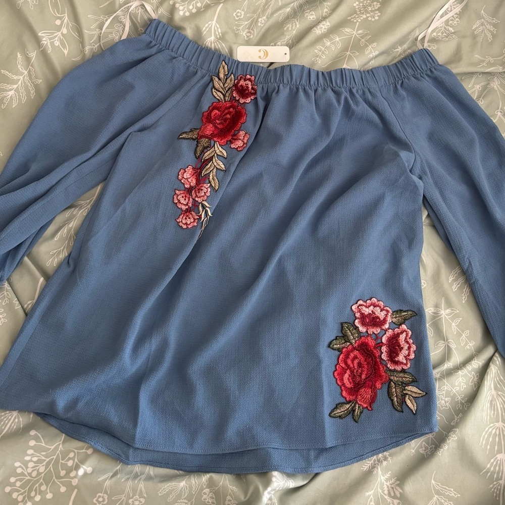 Charming Charlie Blue Blouse with Red Floral Design